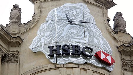 The logo of British bank HSBC is visible on the facade of HSBC France headquarters on the Champs Elysees in Paris, Monday Feb. 9, 2015.